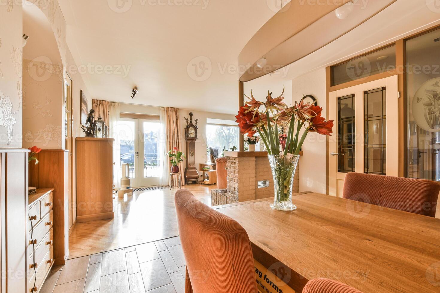 A dining room with a table and chairs photo