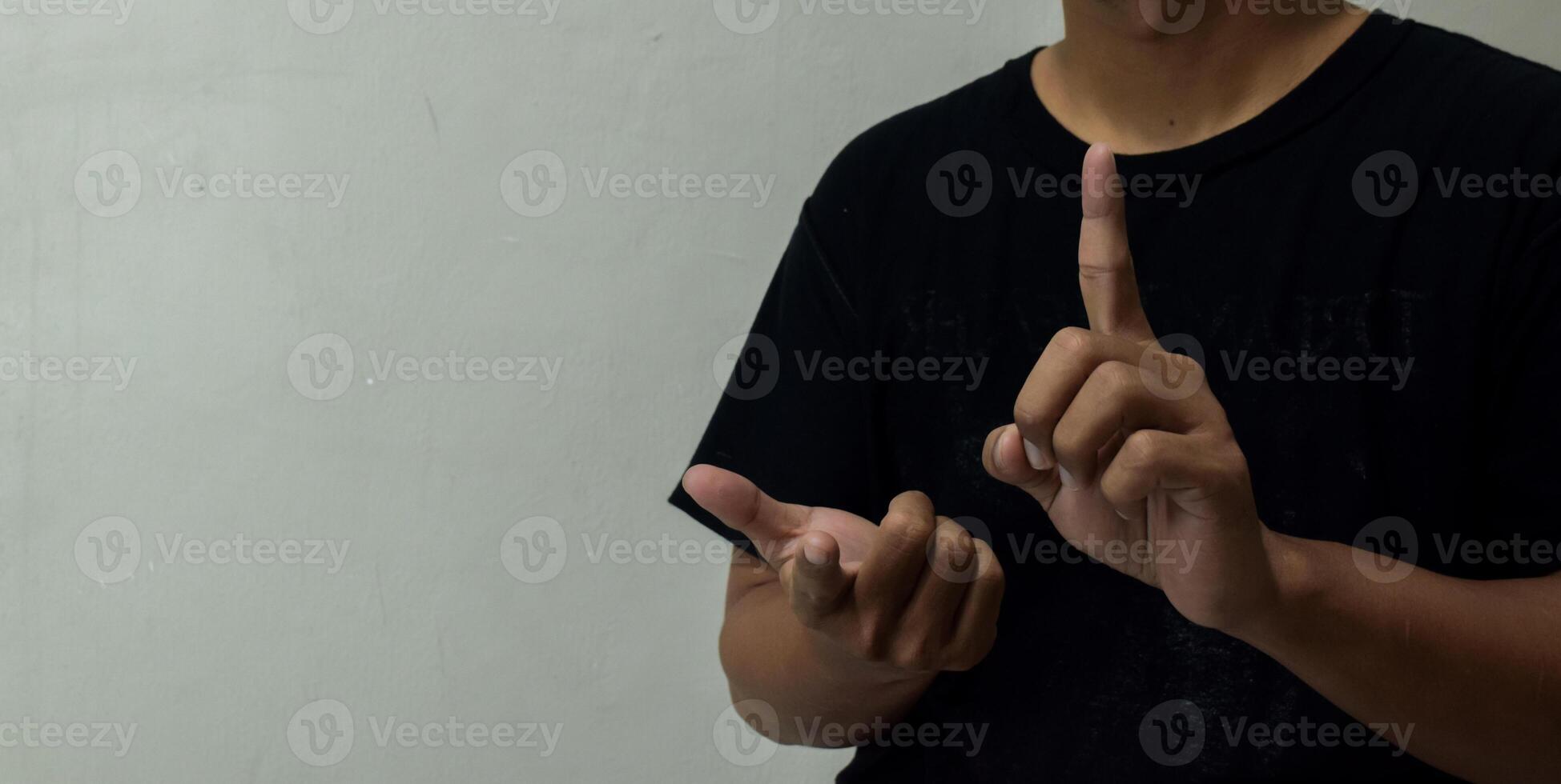 young man learning sign language photo