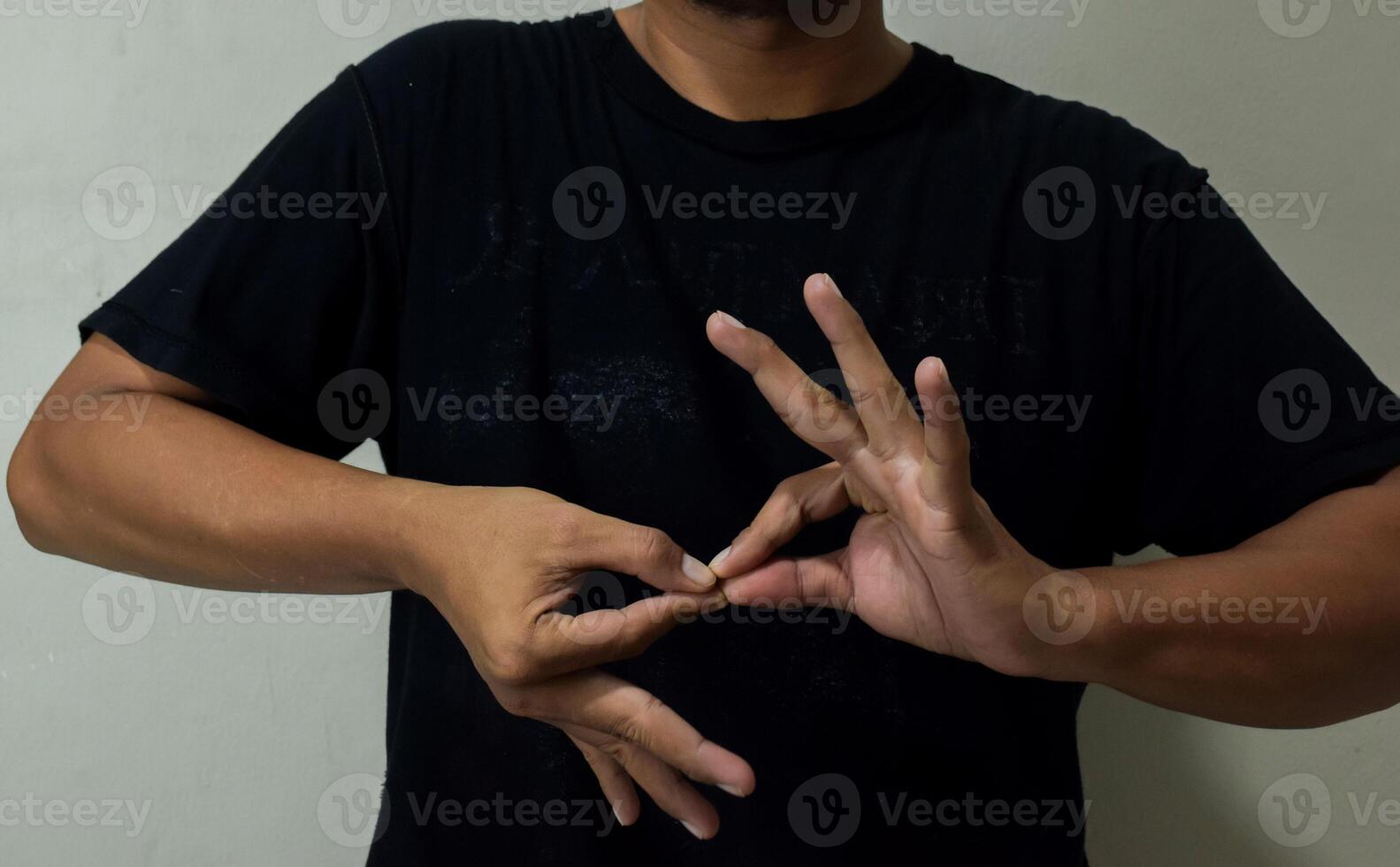 young man using sign language interpreter to communicate photo