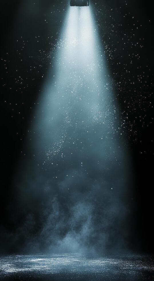 Radiant beams of light shining through a dark space with floating particles in the air photo