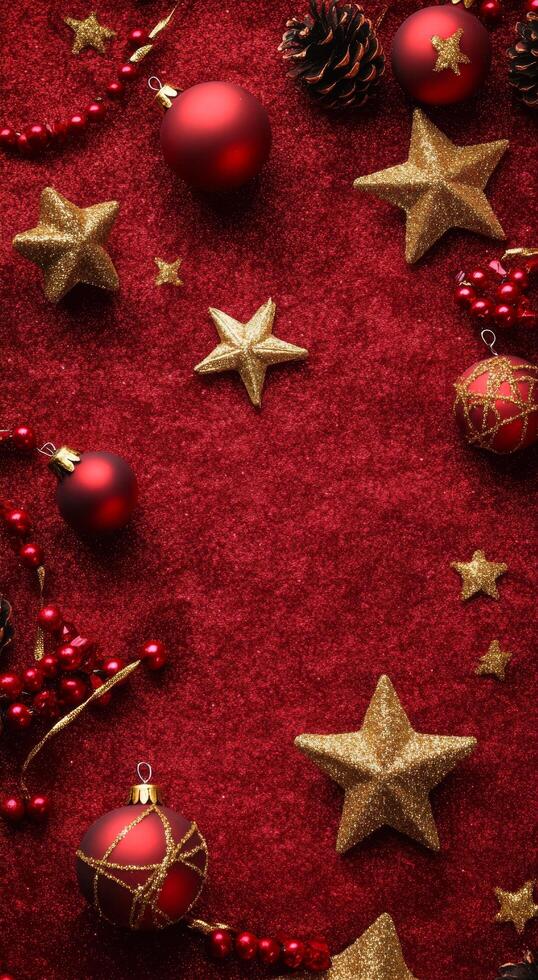 Festive red background with Christmas ornaments, gold stars, and sparkles for holiday decorations photo