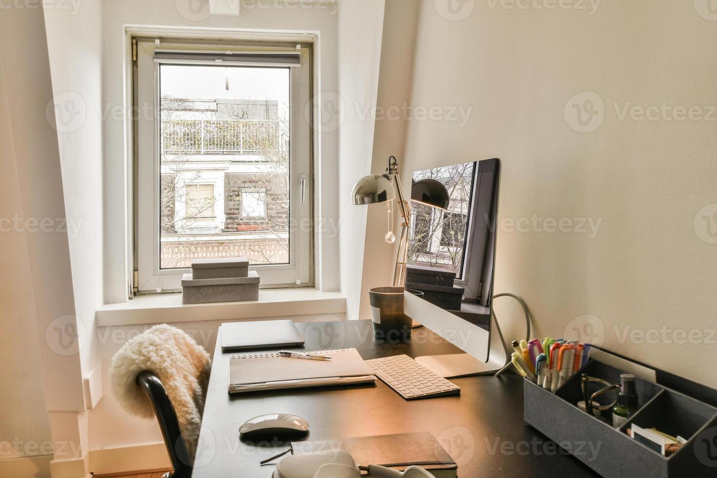 A black desk with a computer photo