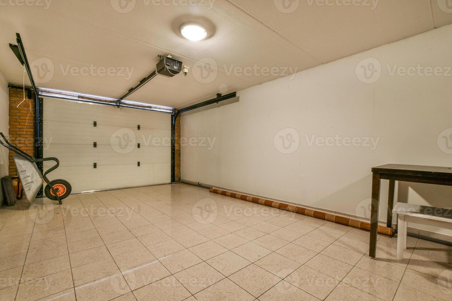 An empty garage with a table and a chair photo