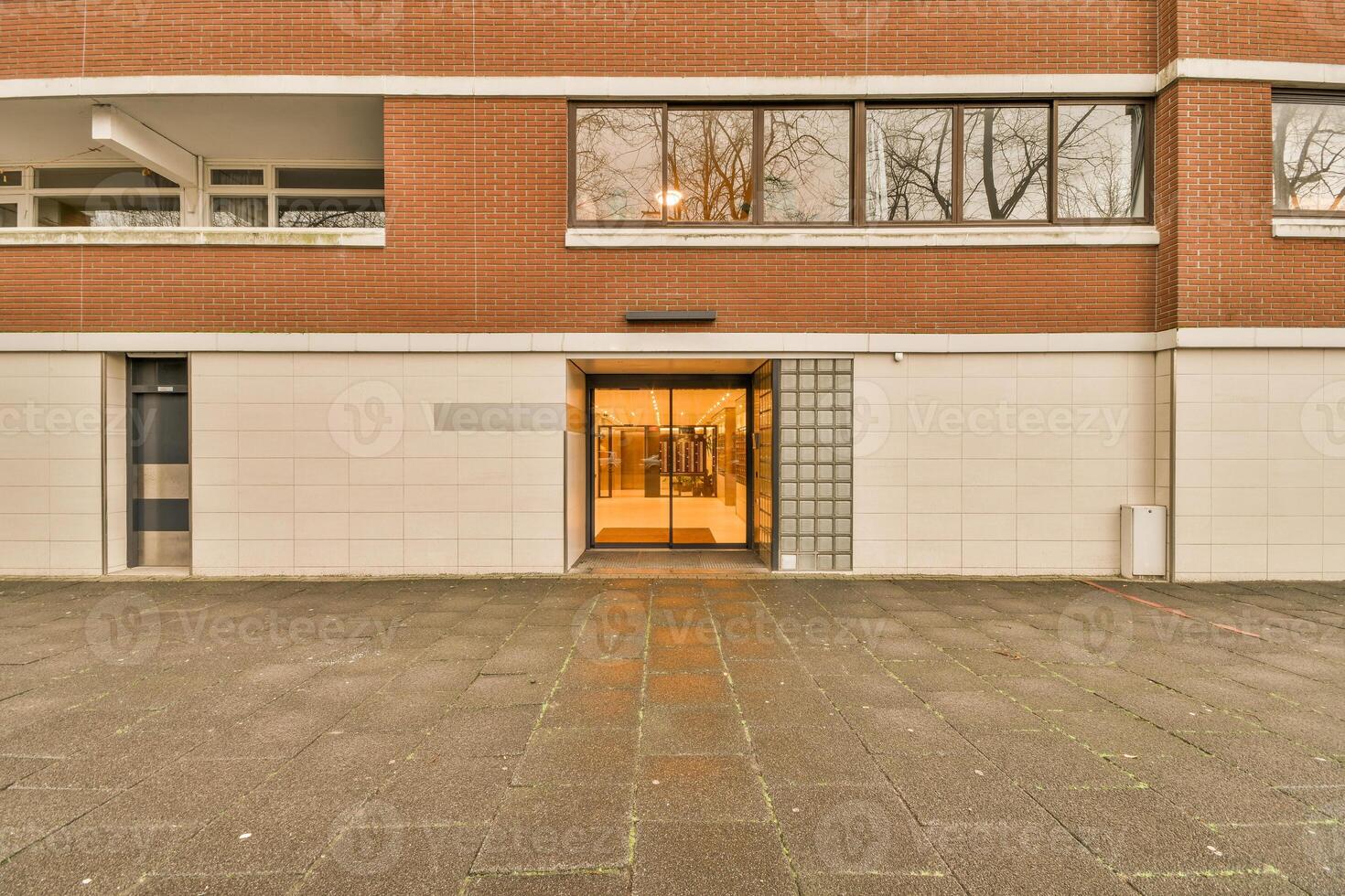 A building with a door and a window in front of it photo