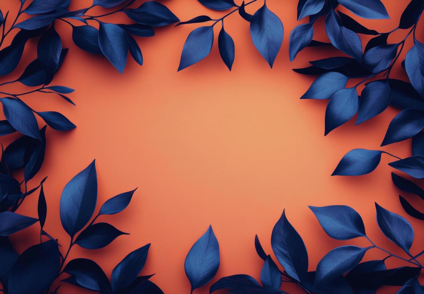 Decorative blue leaves arranged on an orange background for artistic display or design projects photo