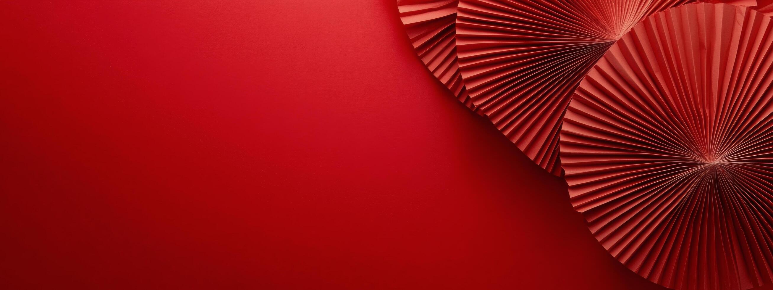 Colorful decorative paper fans arranged on a vibrant red background for a festive occasion photo