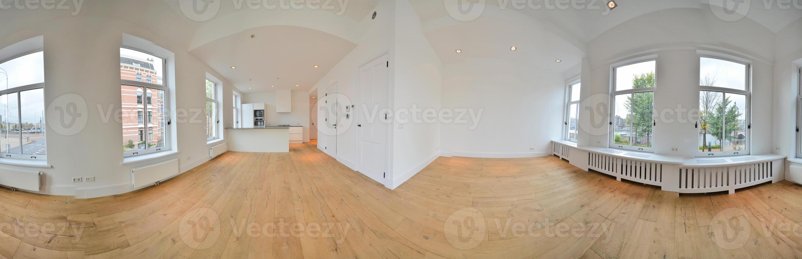 A 360 - view of a room with wooden floors photo