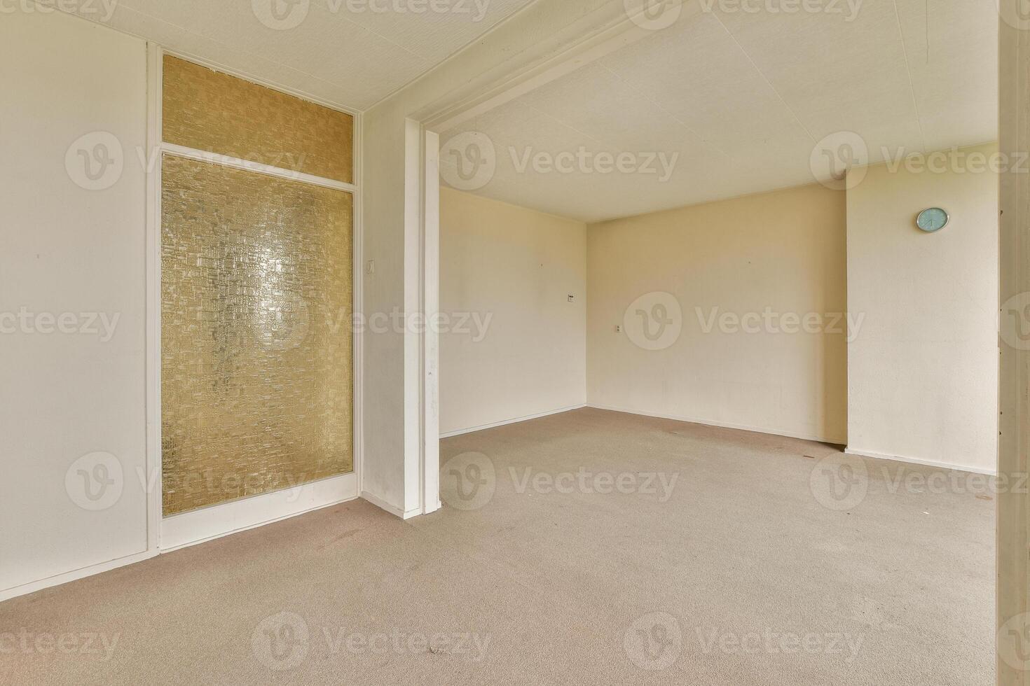 An empty room with a door and a window photo