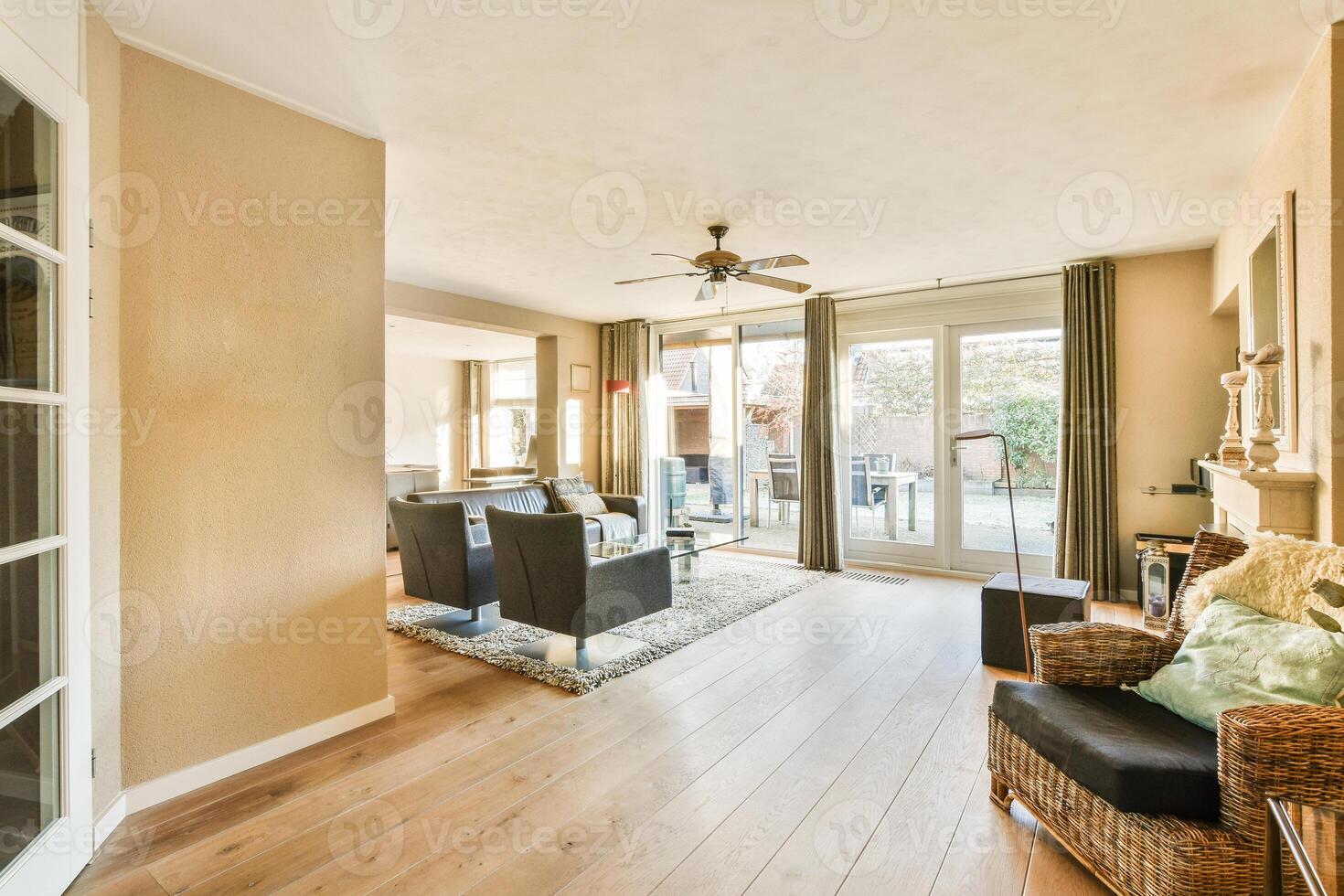 A living room with a wooden floor and a sliding door photo