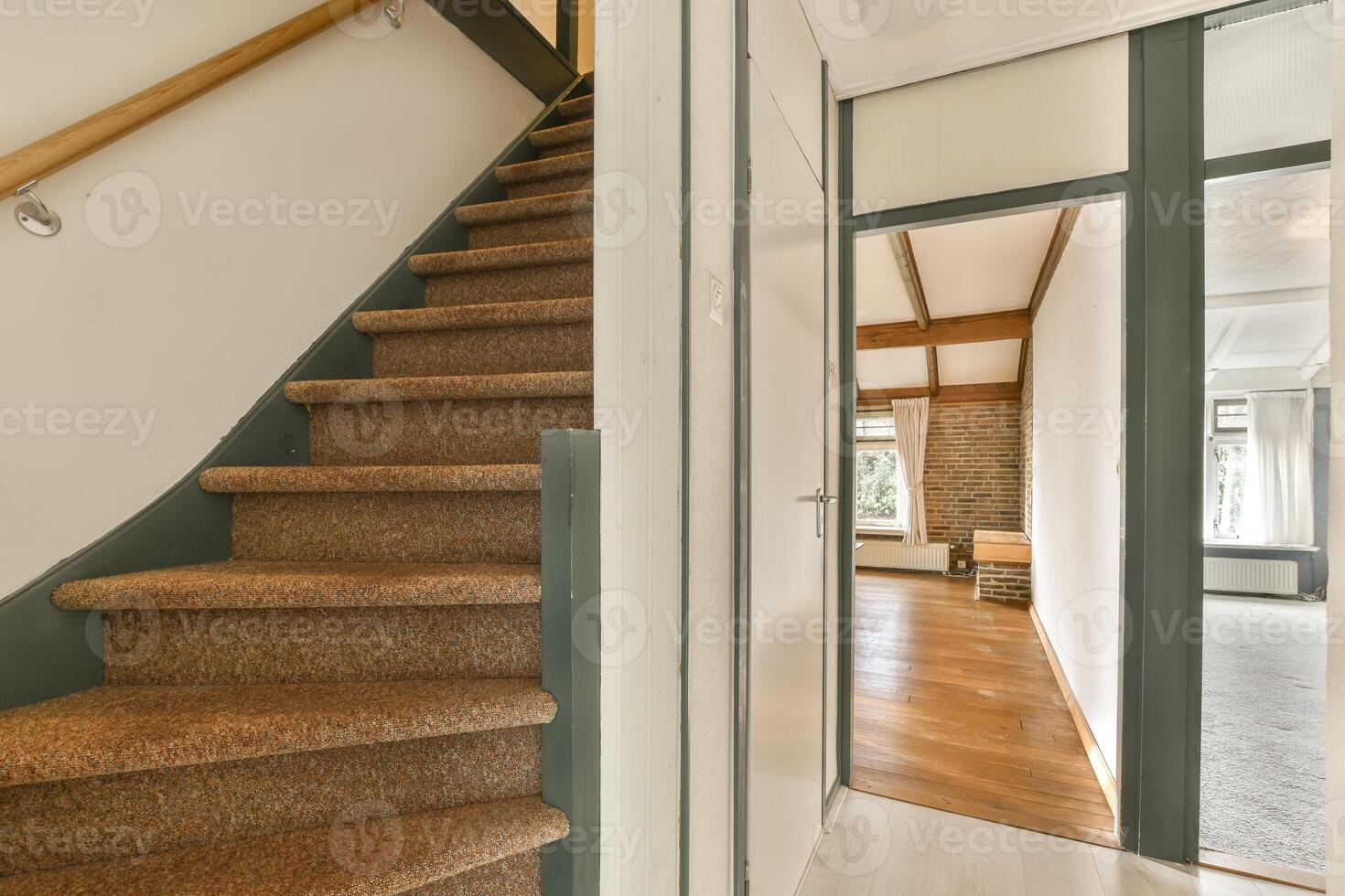 A stairway leading to a room with a door photo