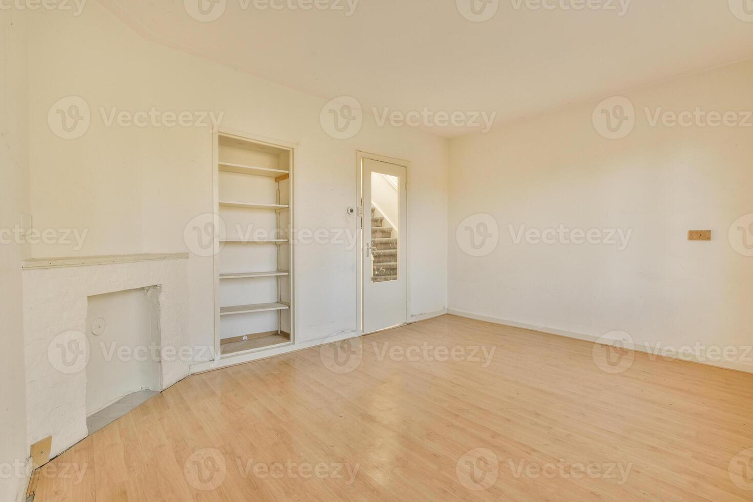 Empty room with wooden floors and shelves photo