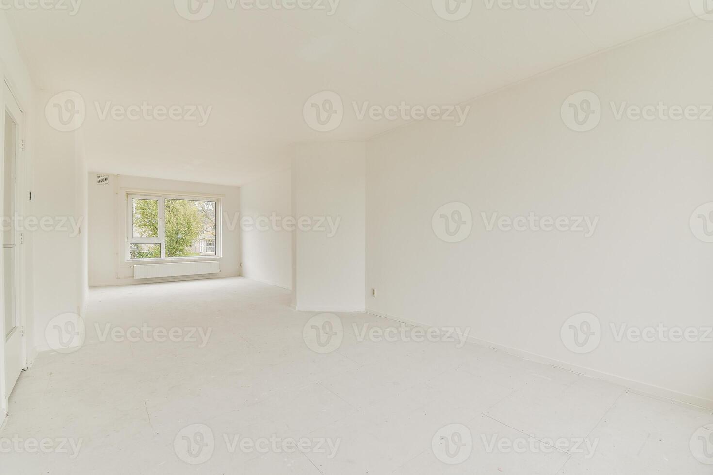 An empty room with white walls and a door photo