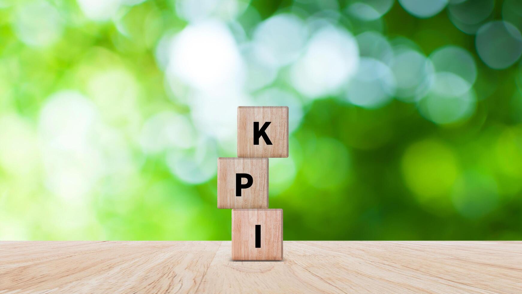 KPI text in wooden cube, Key Performance Indicator concept, Management data System KPI connected database follow earnings, Financial business data analytics graph dashboard. photo