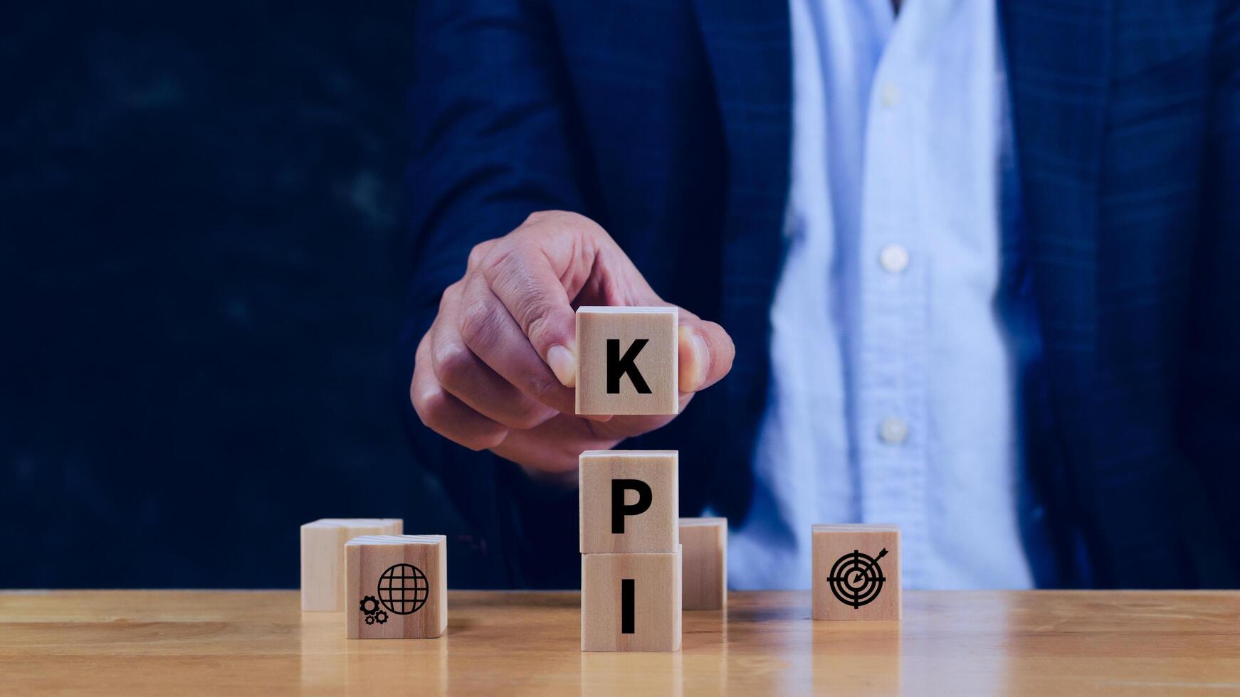 KPI text in wooden cube, Key Performance Indicator concept, Management data System KPI connected database follow earnings, Financial business data analytics graph dashboard. photo