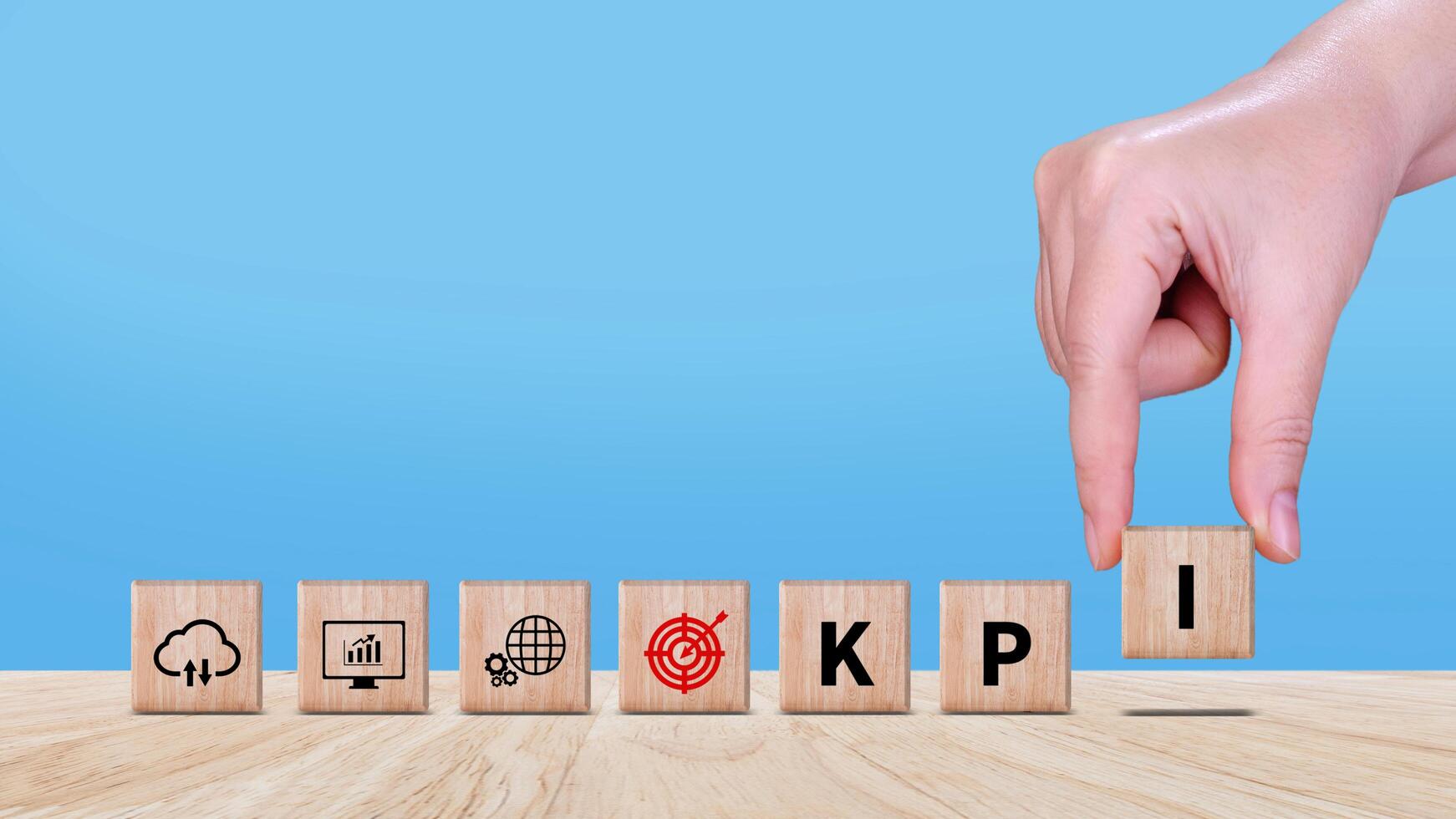 KPI text in wooden cube, Key Performance Indicator concept, Management data System KPI connected database follow earnings, Financial business data analytics graph dashboard. photo