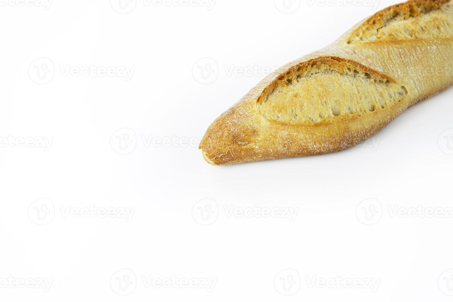Freshly baked French baguette with a crispy golden crust. Ideal for breakfast and dinner. Traditional homemade white bread. Isolated on a white background. Closeup. With clipping path photo