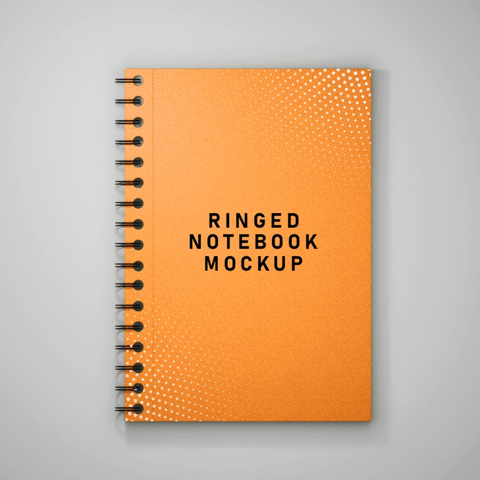 orange notebook with dotted lines and black text psd