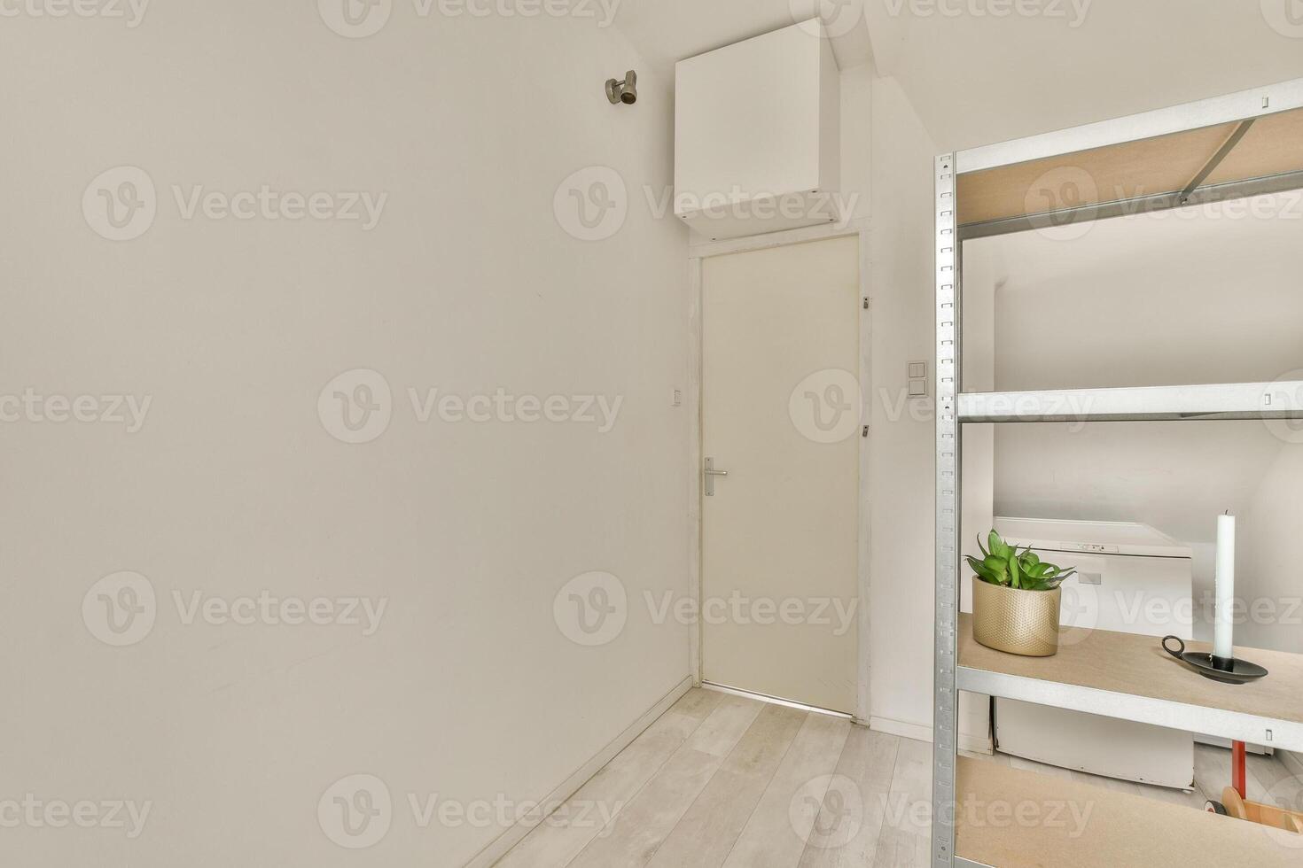 A small room with a shelf and a toilet photo