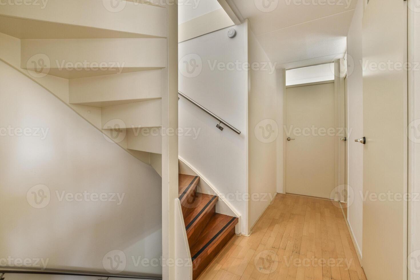 A stairway in a house with a wooden floor photo