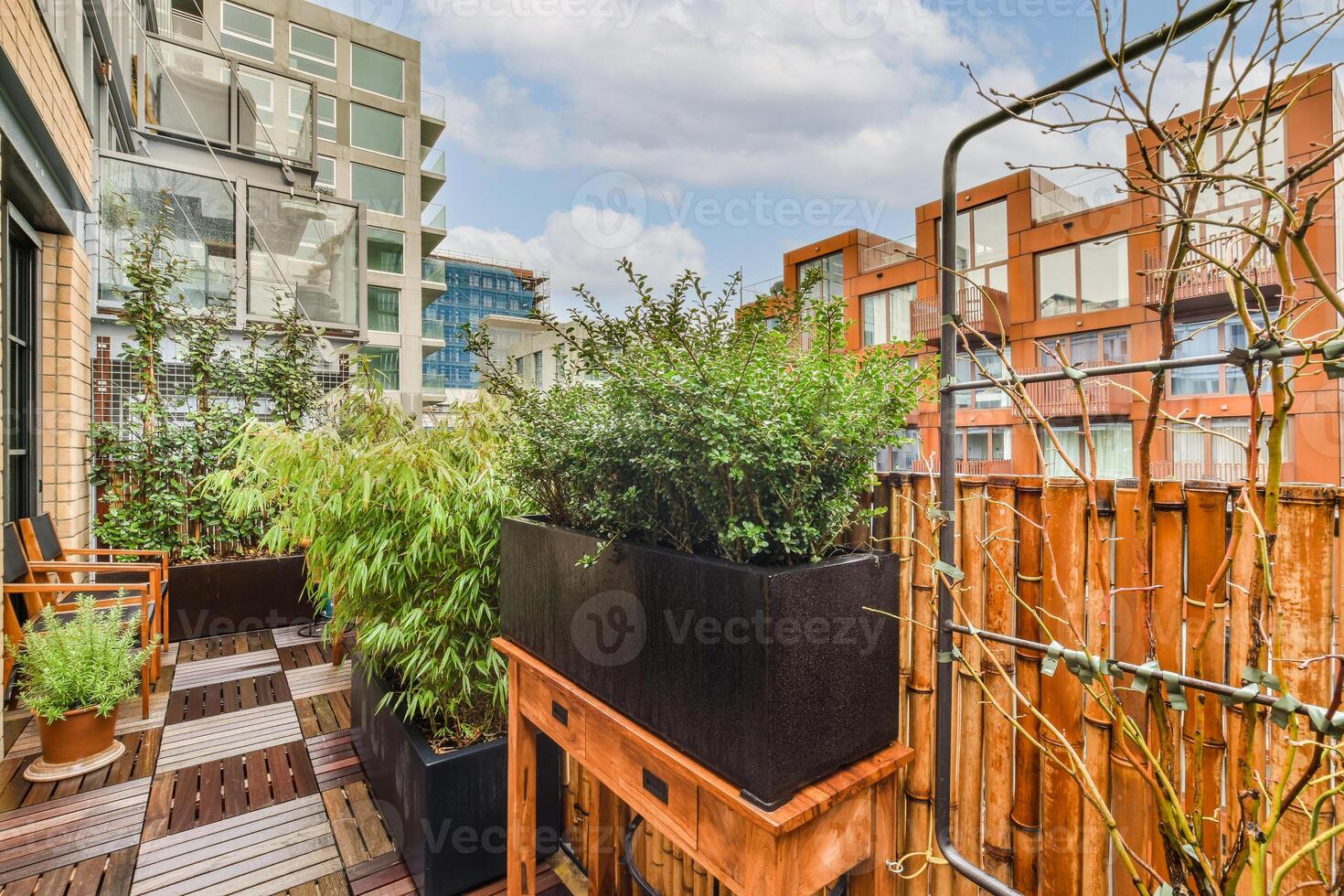 A balcony with plants and a bench photo