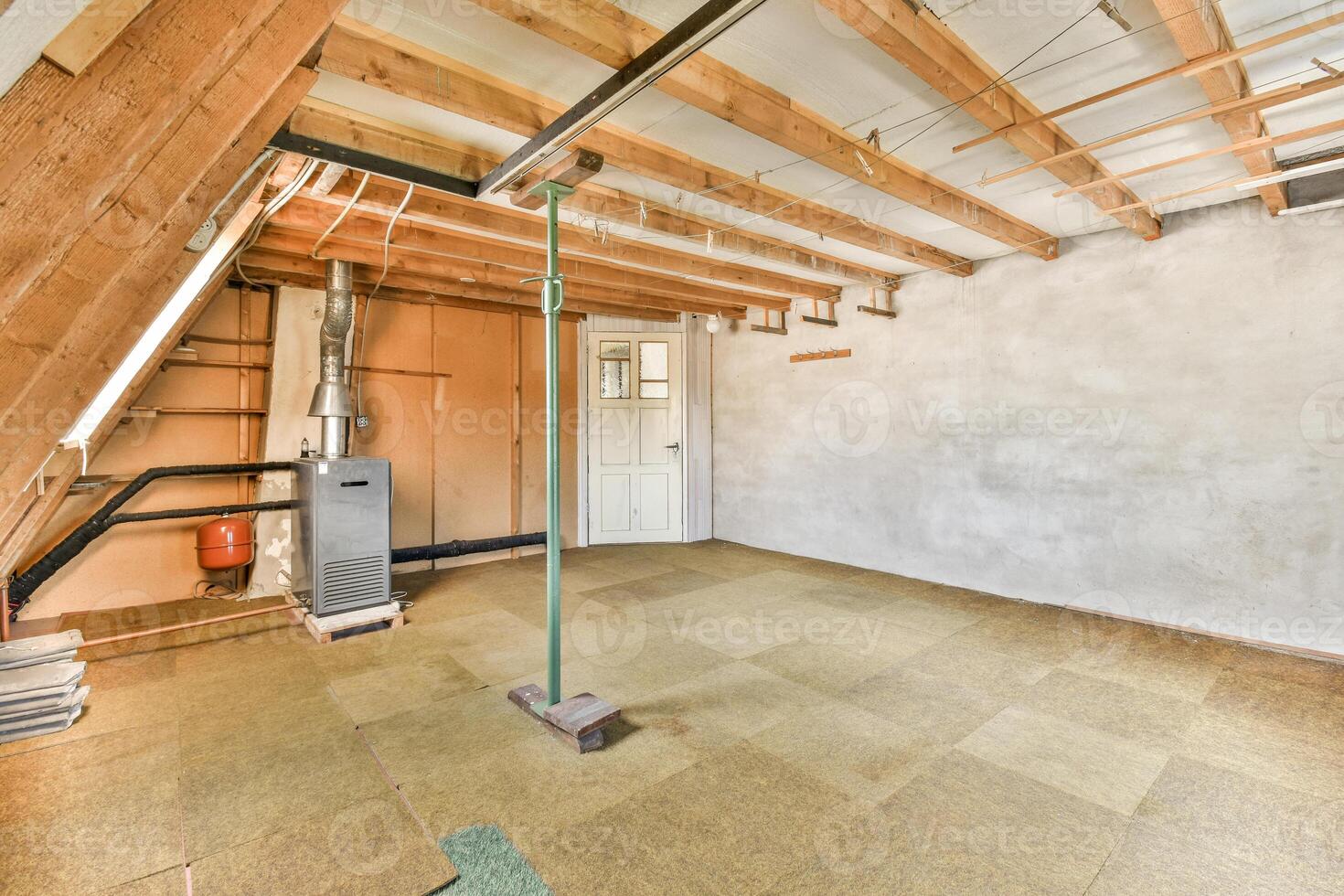 An empty room with a ceiling fan and a heater photo