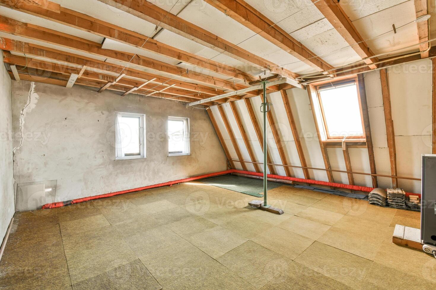 An empty room with a ceiling fan and a window photo