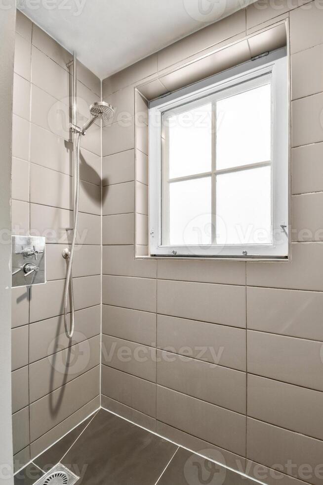 A bathroom with a shower and a window photo