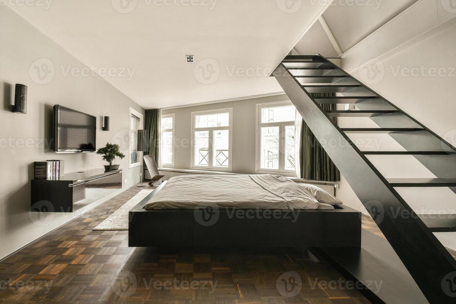 A bed with a tv on top of it photo