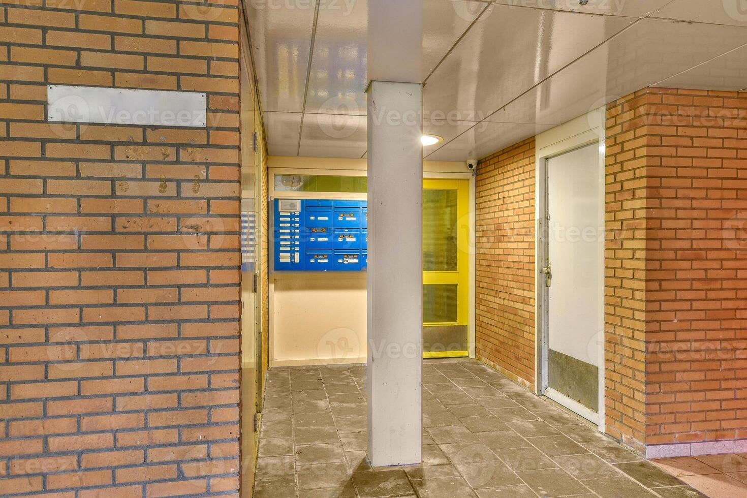 A hallway with a door and a sign on it photo