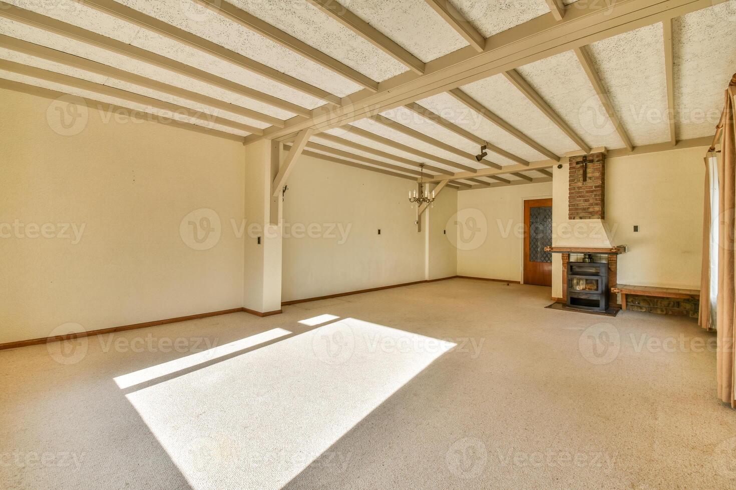 A room with a fireplace and a window photo