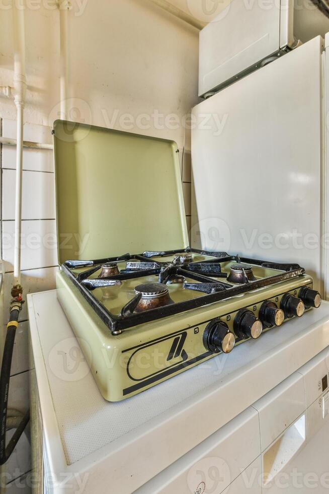 A stove top with a gas burner photo