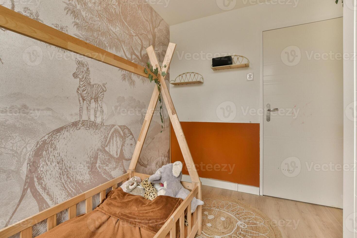 A baby's room with a wooden bed and a wall mural photo