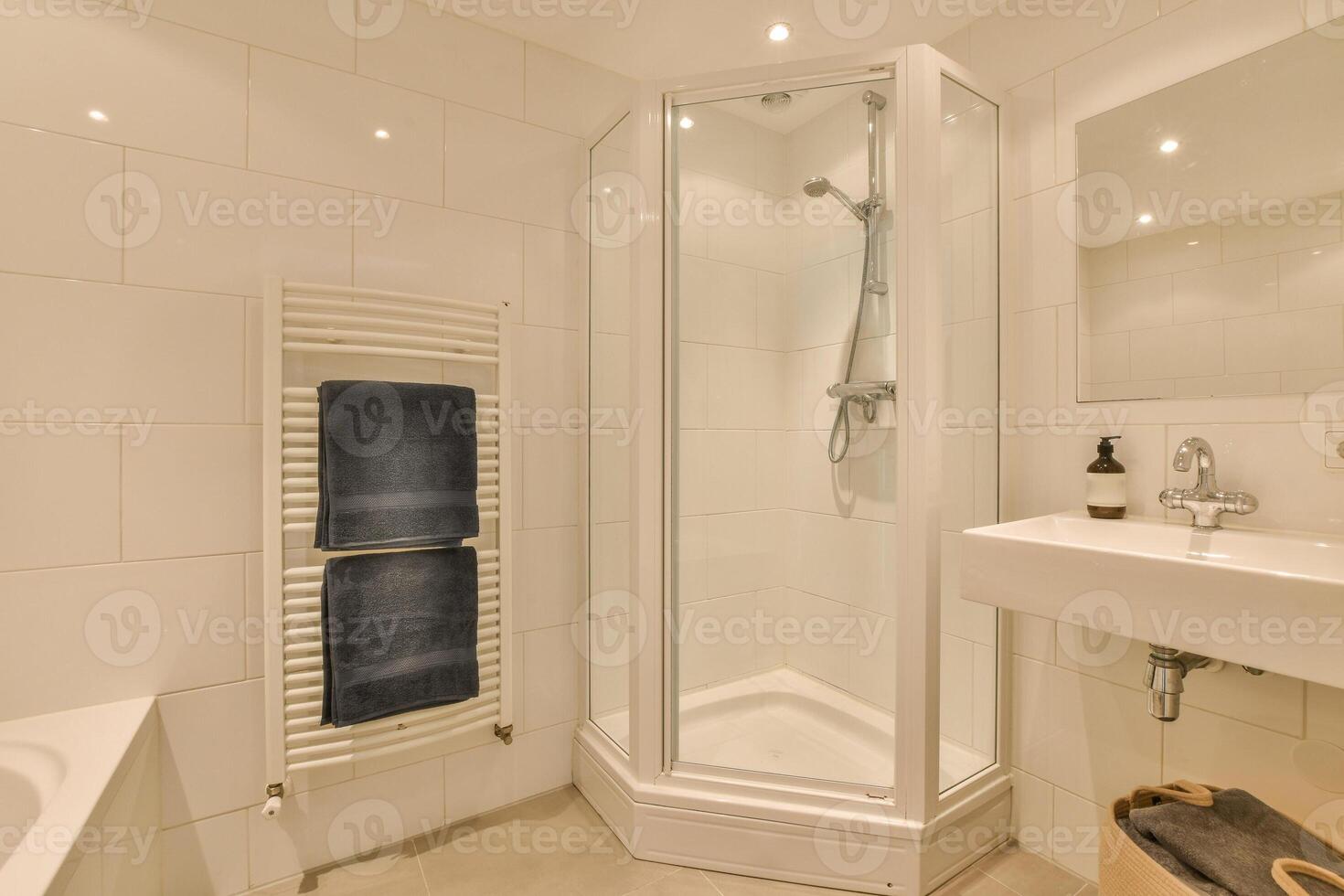 A bathroom with a shower and a sink photo
