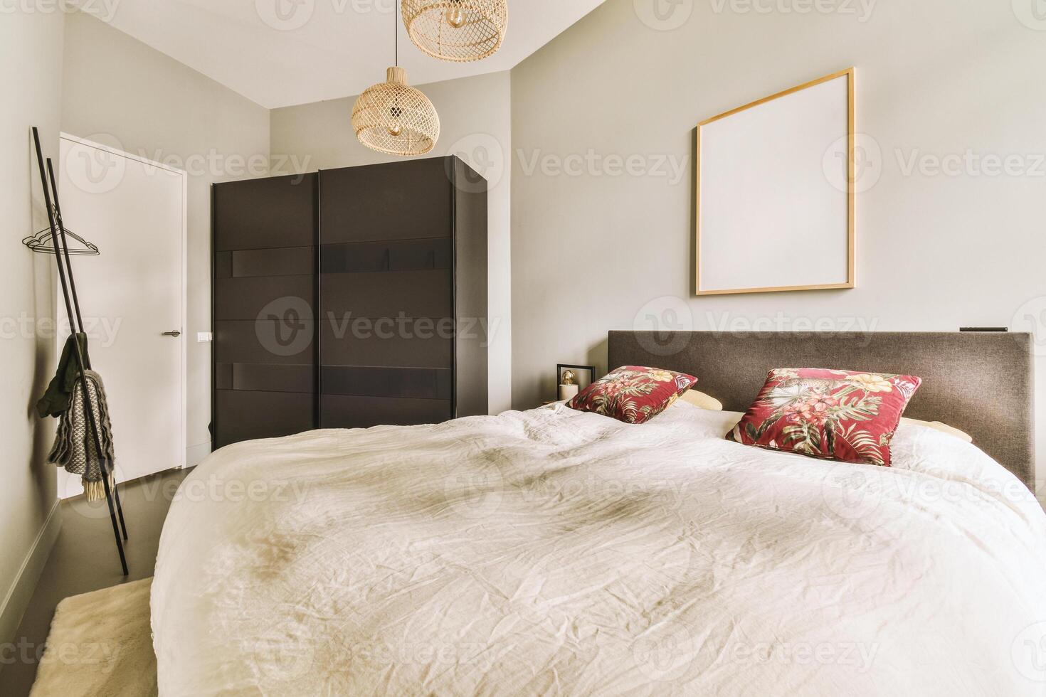 A bed with a white comforter photo