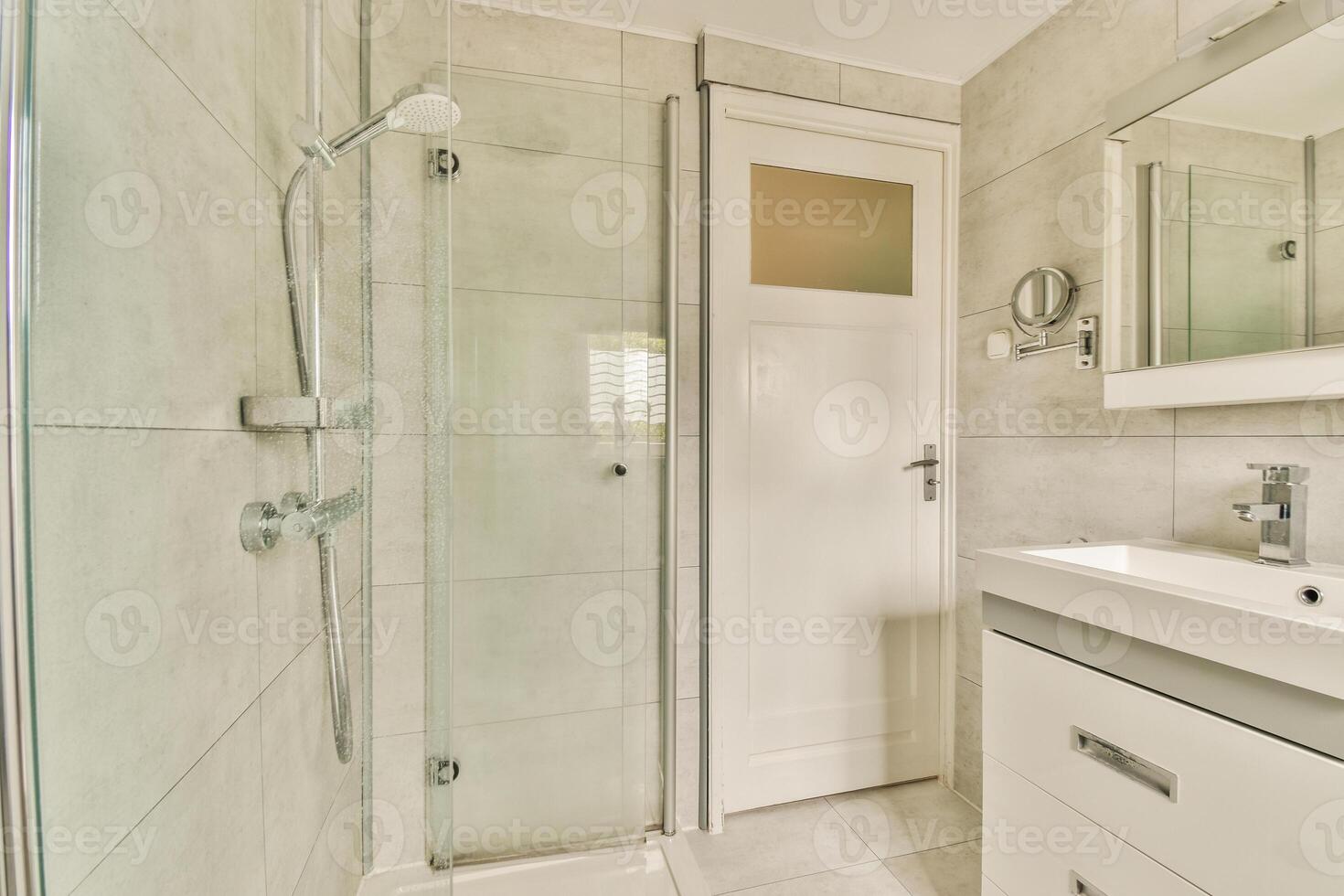 A bathroom with a shower and sink photo