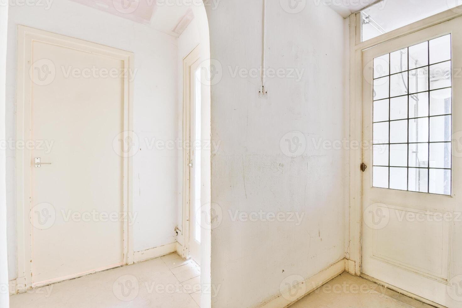 A room with two doors and a window photo