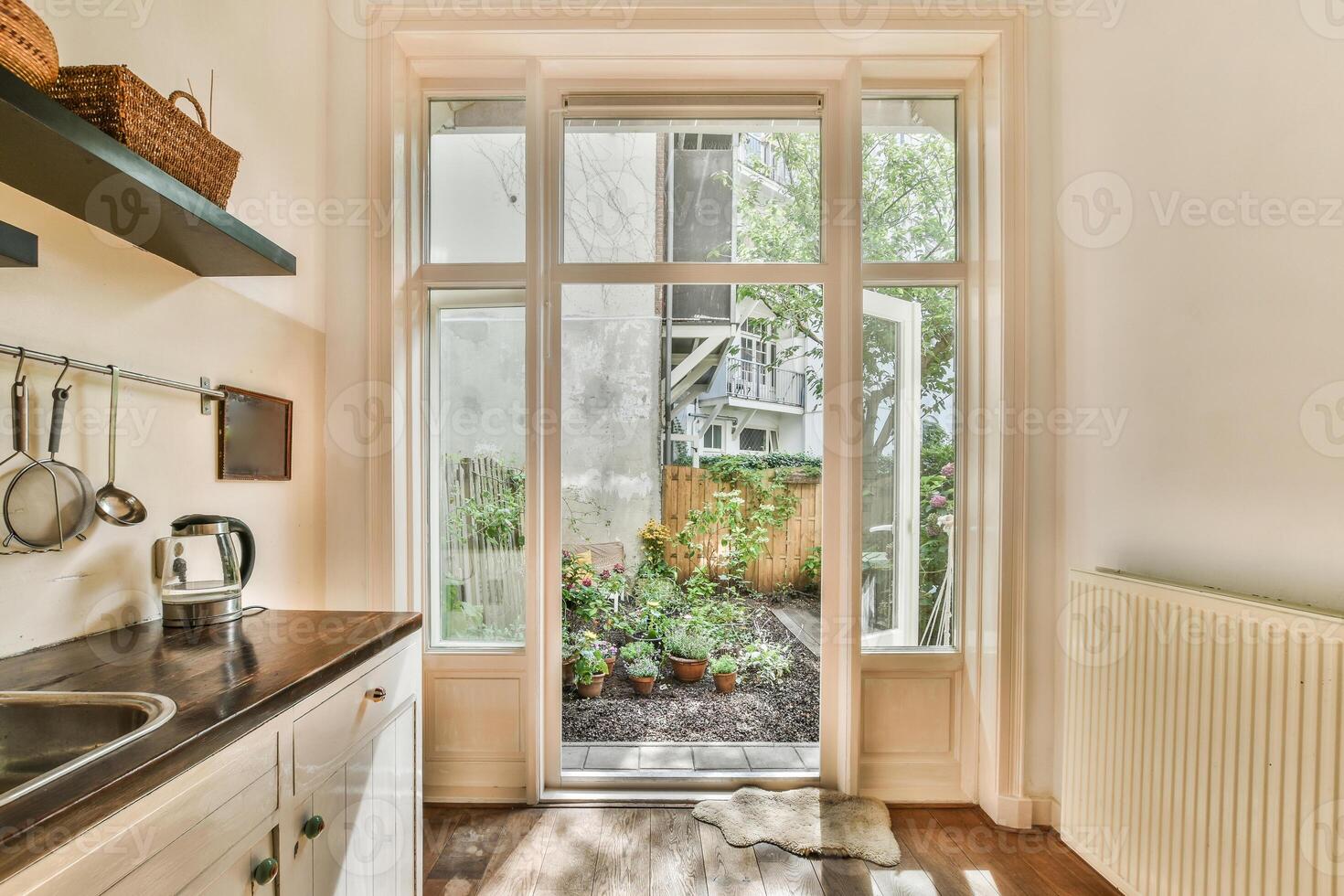 A kitchen with a sink and a window photo