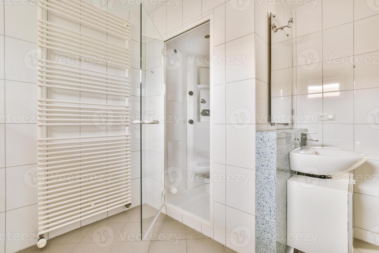 A bathroom with a shower, sink and toilet photo