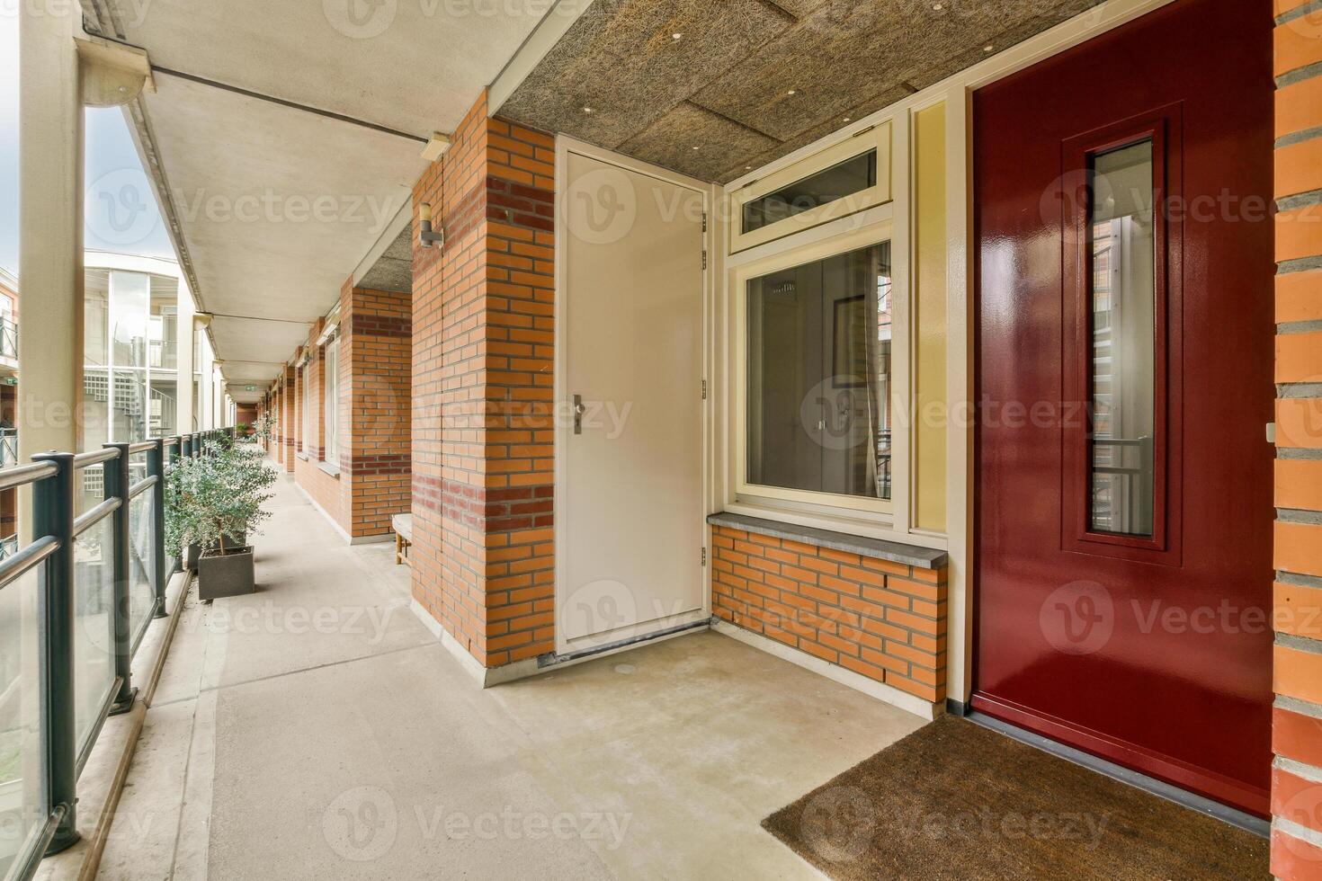 A red door on a brick wall photo