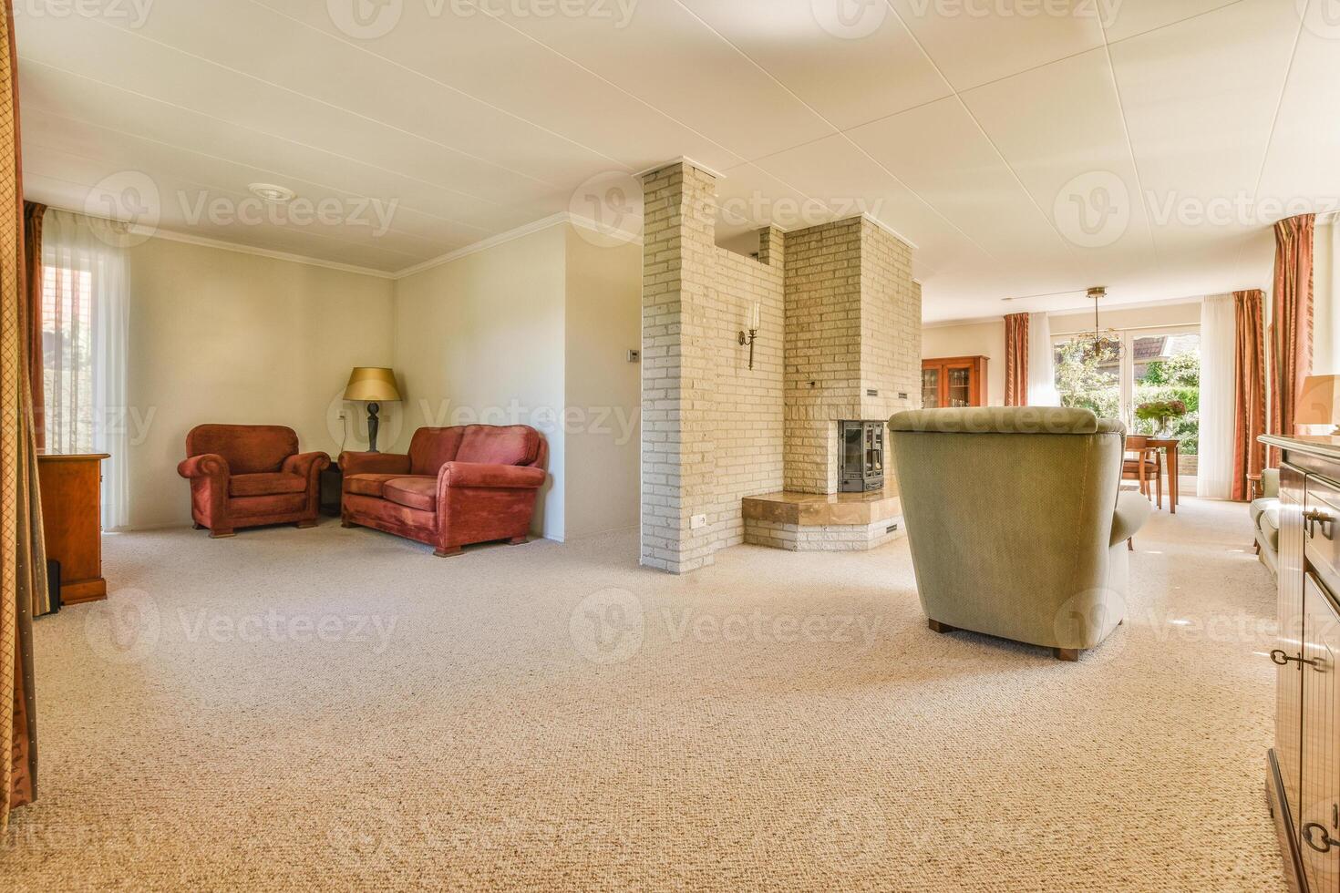 A living room with a fireplace and a couch photo