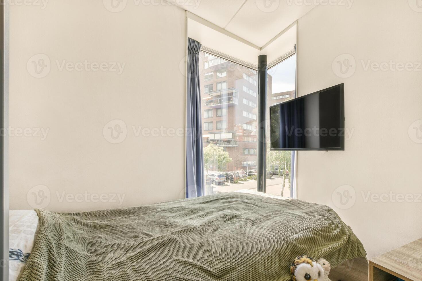 A bed with a tv in the corner photo