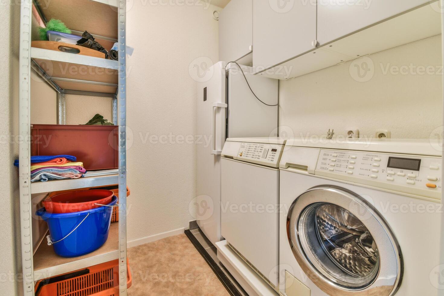 A laundry room with a washer and dryer photo