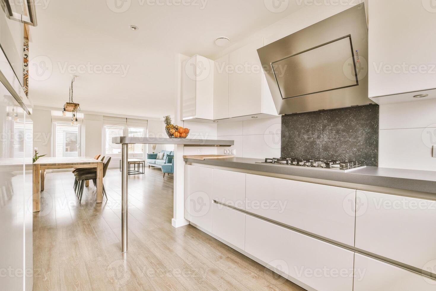 A kitchen with a stove and a sink photo