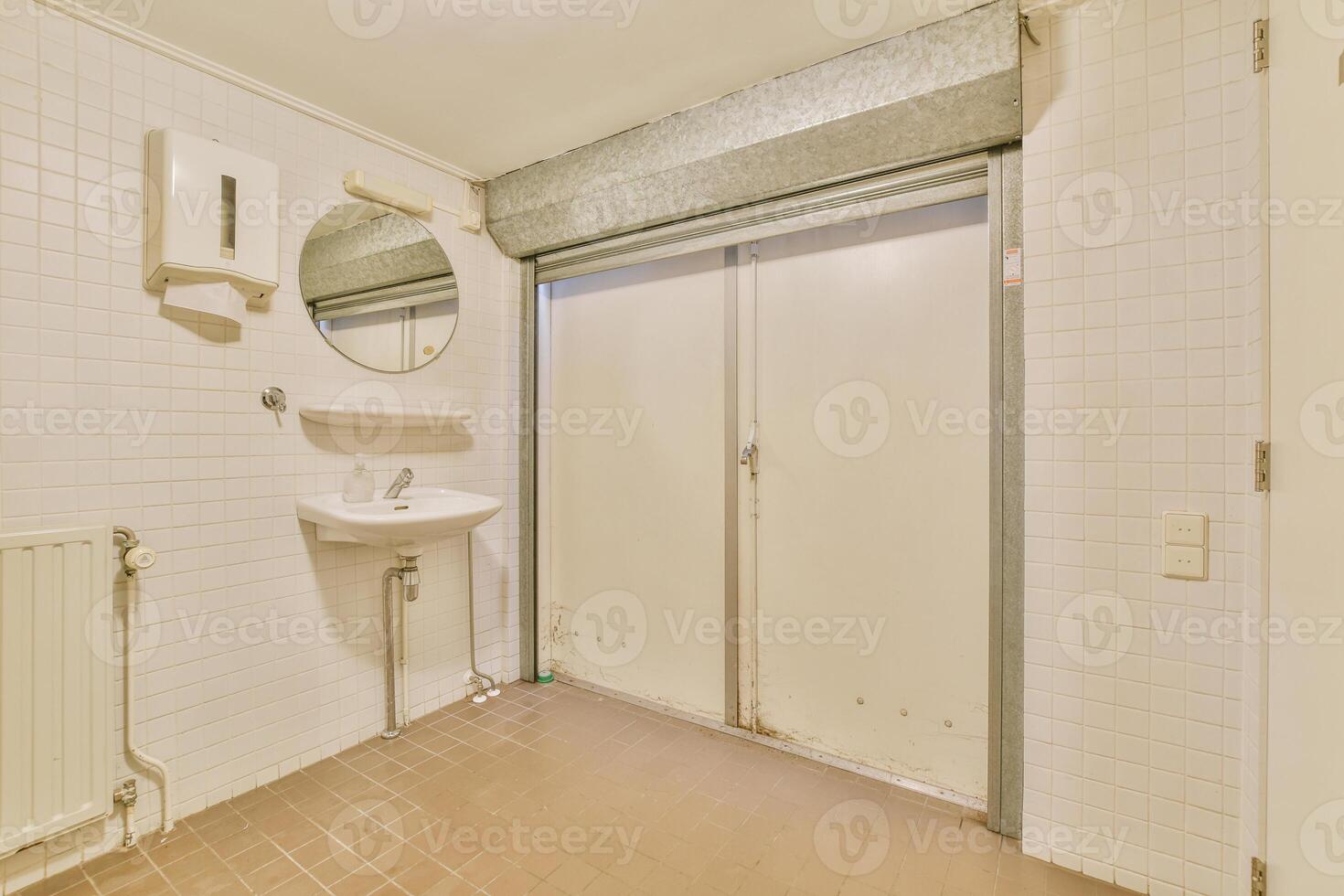 A bathroom with a sink and a mirror photo
