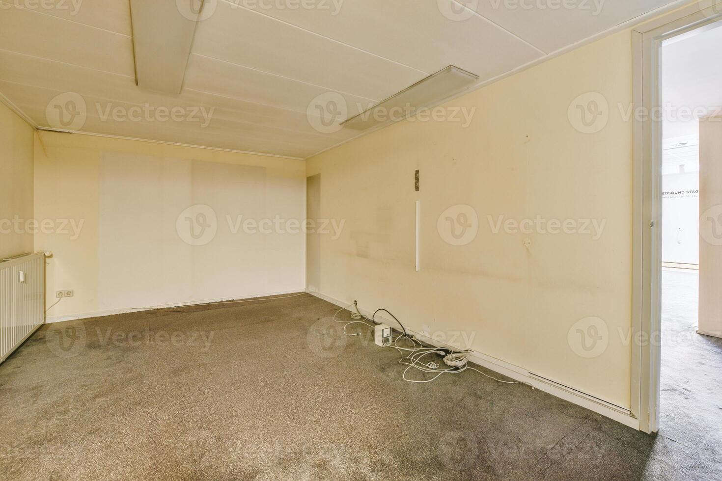An empty room with a door and a window photo