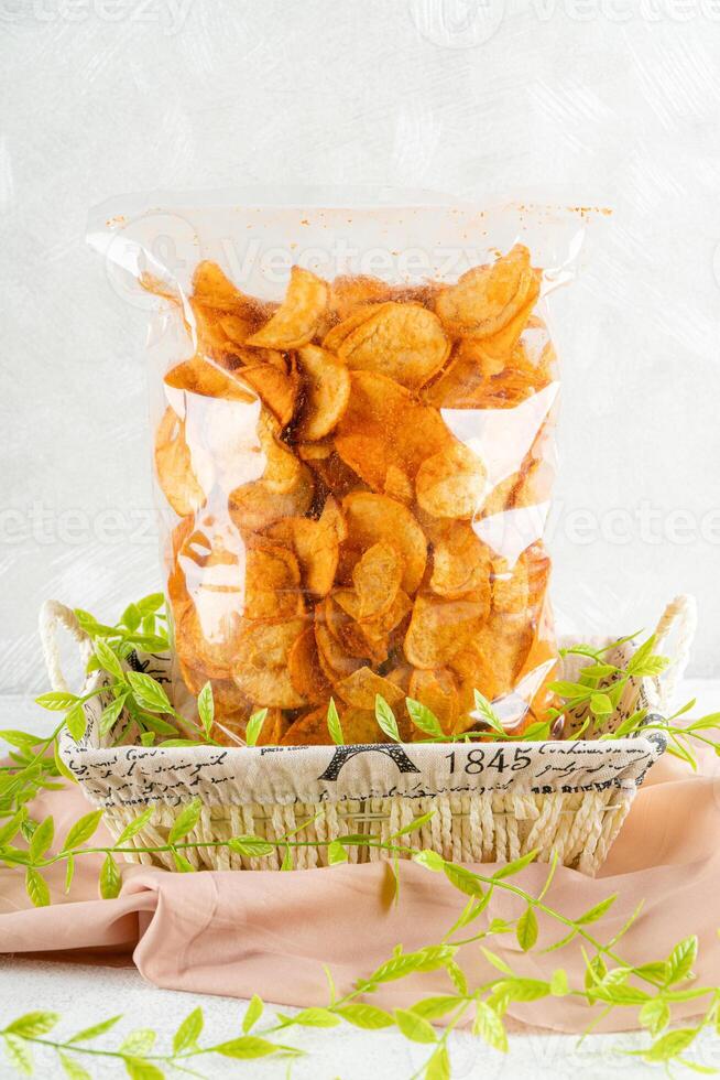 Potato chips are thin strips of potato that are deep fried or baked until crisp. Potato chips are generally served as an appetizer or snack. photo