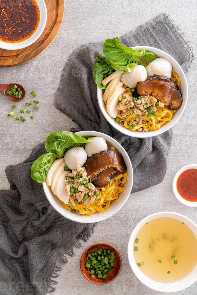 Bak chor mee. The noodles are tossed in vinegar, minced meat, pork slices, pork liver, stewed sliced mushrooms, meat balls and bits of deep-fried lard photo