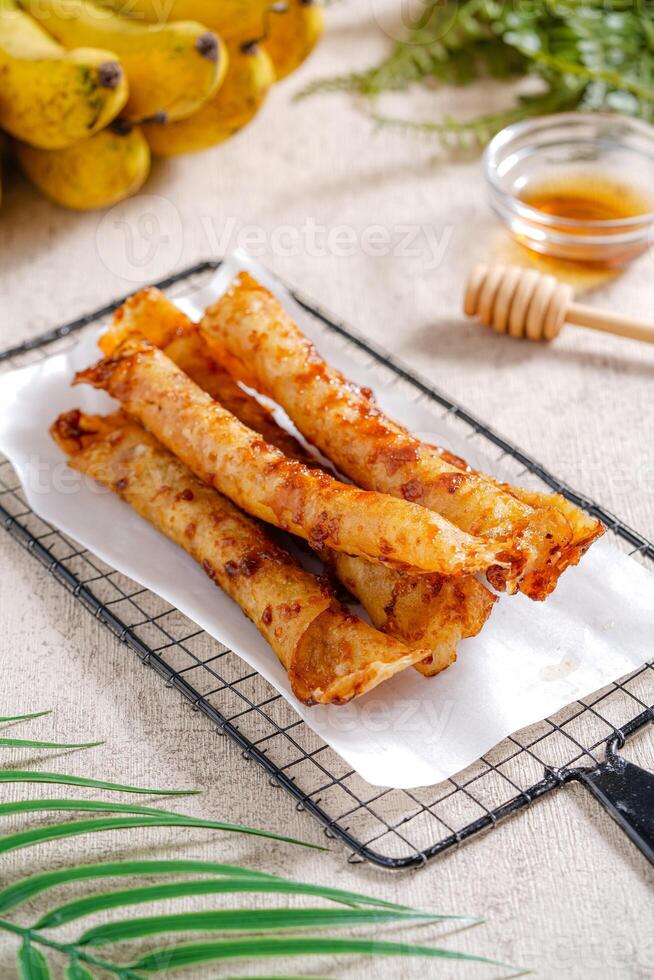 Piscok or banana chocolate is traditional snacks from Indonesia. made of fried banana wrapped in spring roll skin. photo