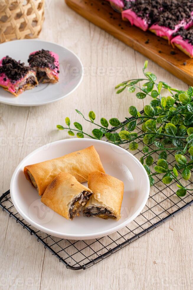 Piscok or banana chocolate is traditional snacks from Indonesia. made of fried banana wrapped in spring roll skin. photo