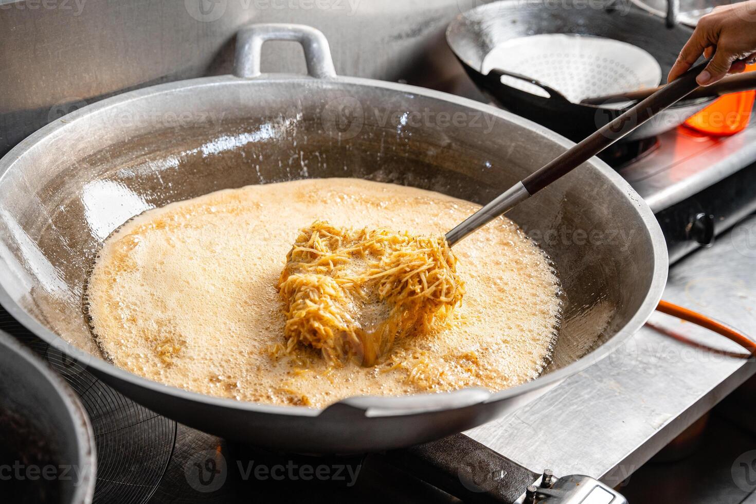 Dried potato or potato mustofa is the term for dry match-shaped potatoes stir-fried with Indonesian spices. photo